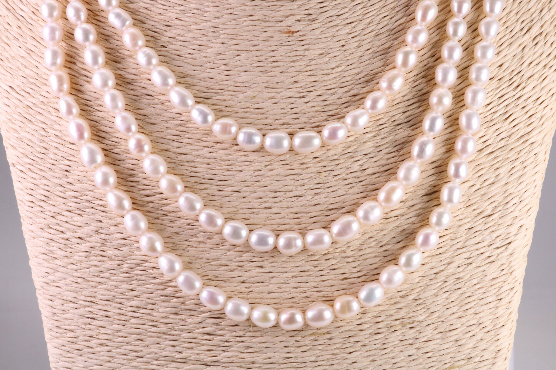 Three Strand Natural 7 mm Oval Shaped Pearl Necklace set in Silver, Three Strands Measures 16, 18 and 20 inches Long