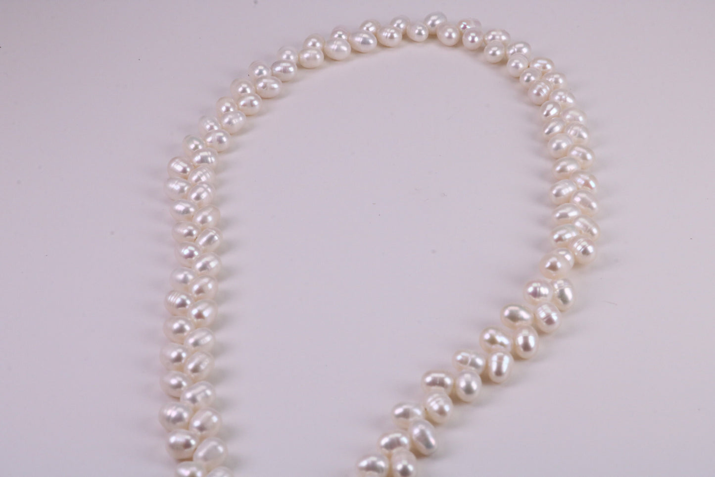 Natural 5 mm Rice Pearl Necklace set in Silver, Double Stranded and Measures 16 inches Long