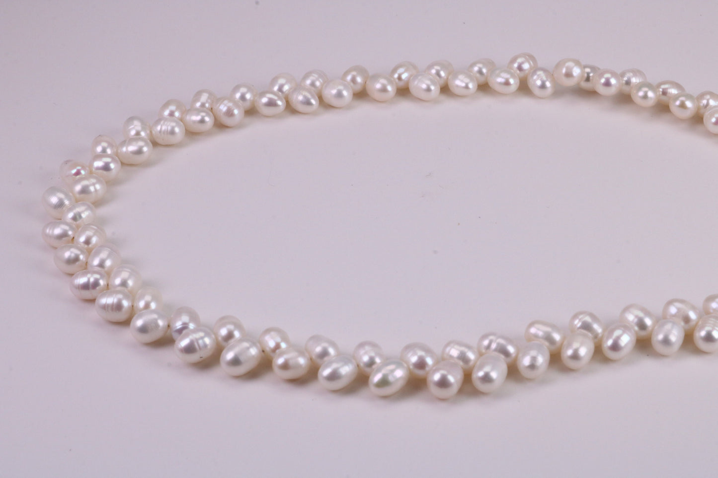 Natural 5 mm Rice Pearl Necklace set in Silver, Double Stranded and Measures 16 inches Long