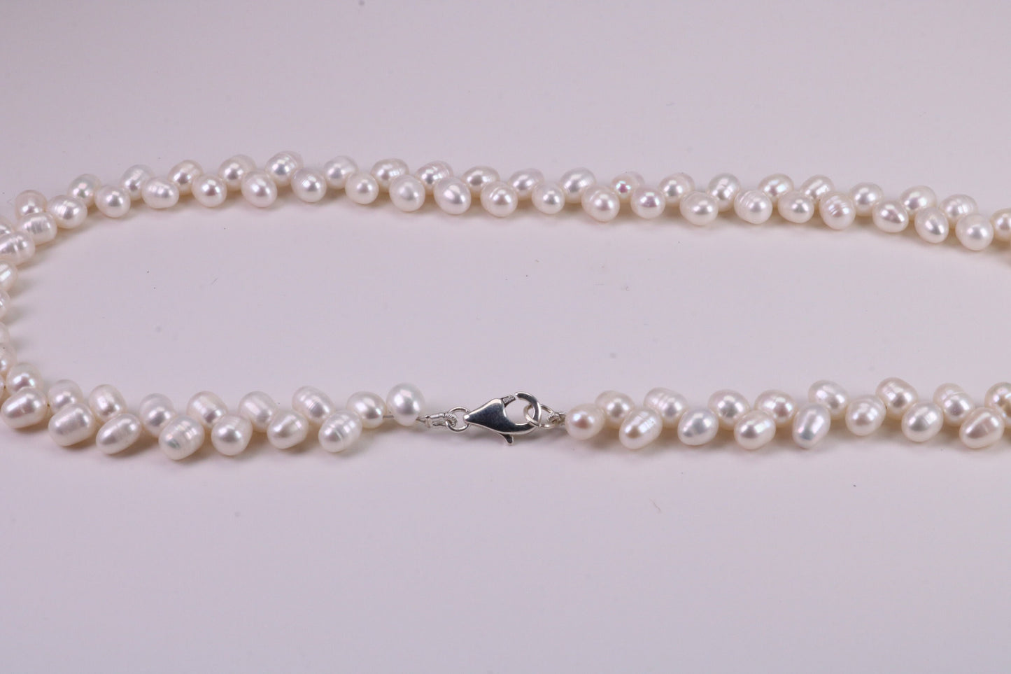 Natural 5 mm Rice Pearl Necklace set in Silver, Double Stranded and Measures 16 inches Long
