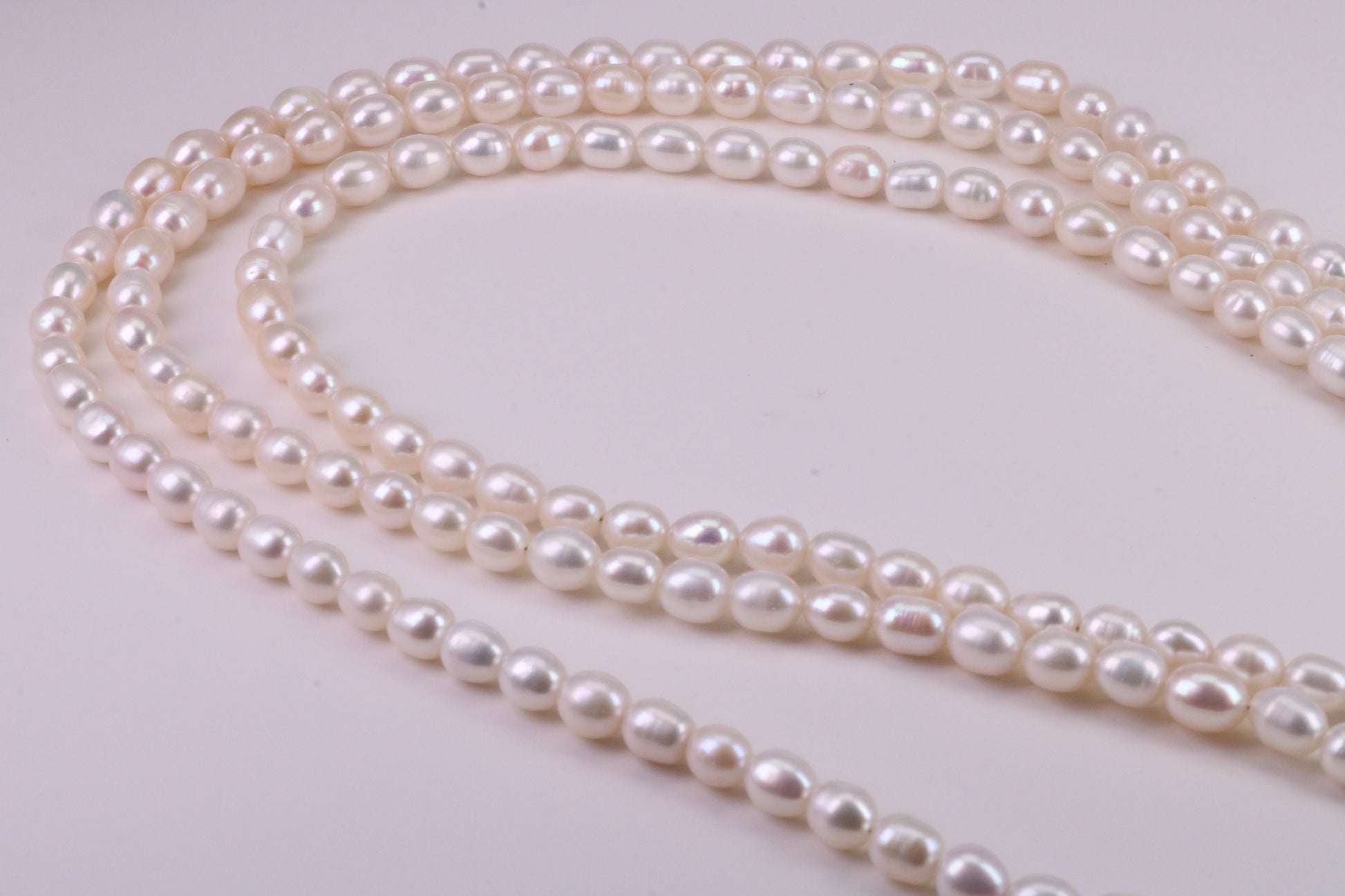 Three Strand Natural 7 mm Oval Shaped Pearl Necklace set in Silver, Three Strands Measures 16, 18 and 20 inches Long