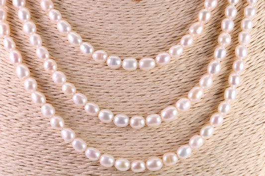 Three Strand Natural 7 mm Oval Shaped Pearl Necklace set in Silver, Three Strands Measures 16, 18 and 20 inches Long