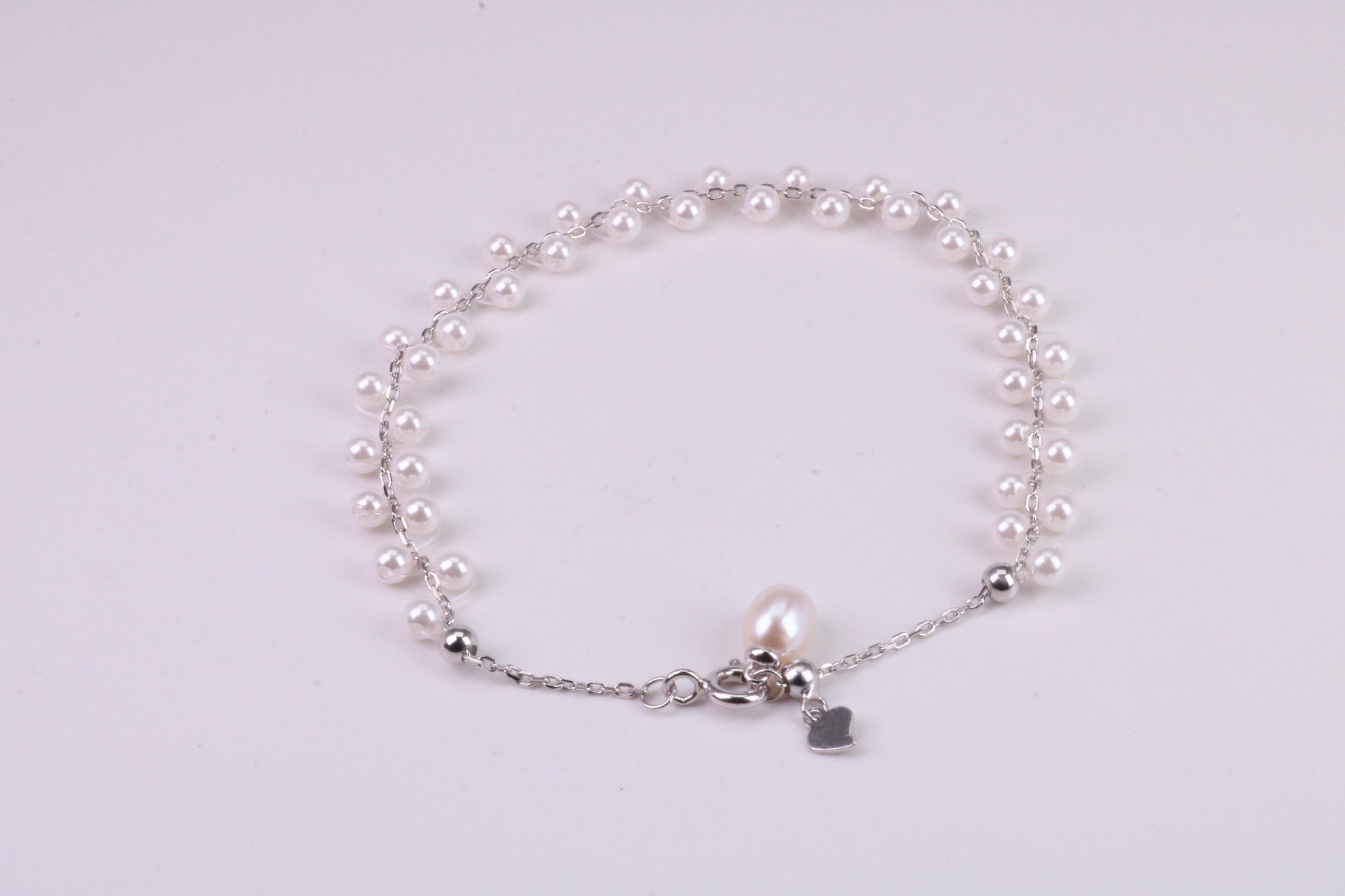 Natural 7.50 inches Long x 7 mm Wide Pearl Bracelet, made from Sterling Silver