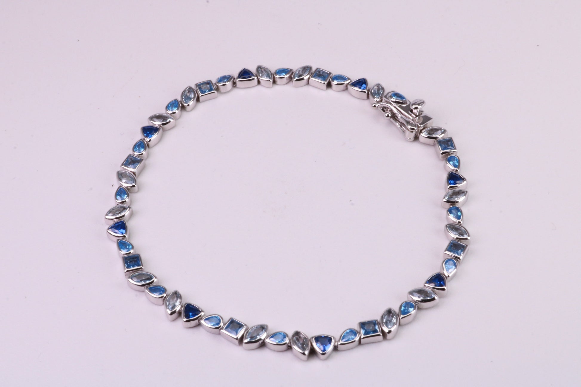 Blue Sapphire, Aquamarine and Topaz C Z Set Bracelet, 7.50 inch Length, Made from solid Sterling Silver
