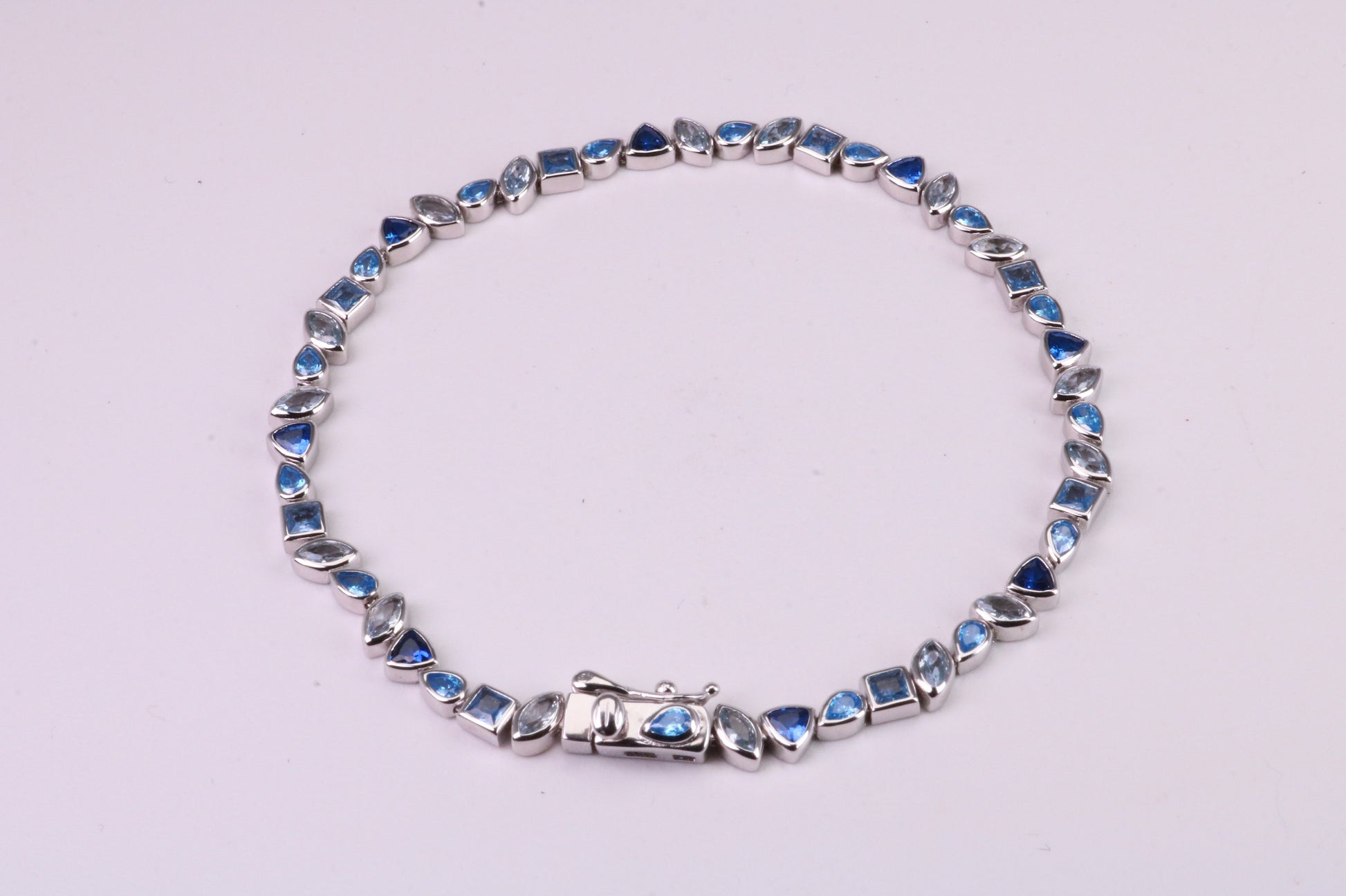 Blue Sapphire, Aquamarine and Topaz C Z Set Bracelet, 7.50 inch Length, Made from solid Sterling Silver