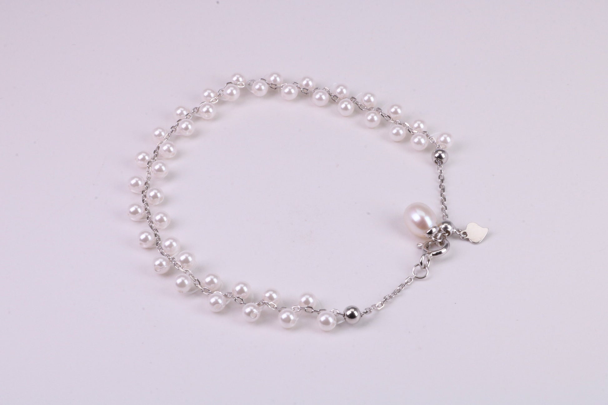 Natural 7.50 inches Long x 7 mm Wide Pearl Bracelet, made from Sterling Silver
