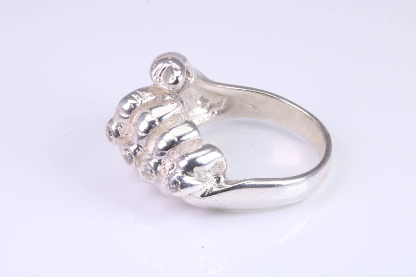 Very large and very heavy fist ring set with diamond white top grade cubic zirconia's, made from solid cast Silver , British Hallmarked