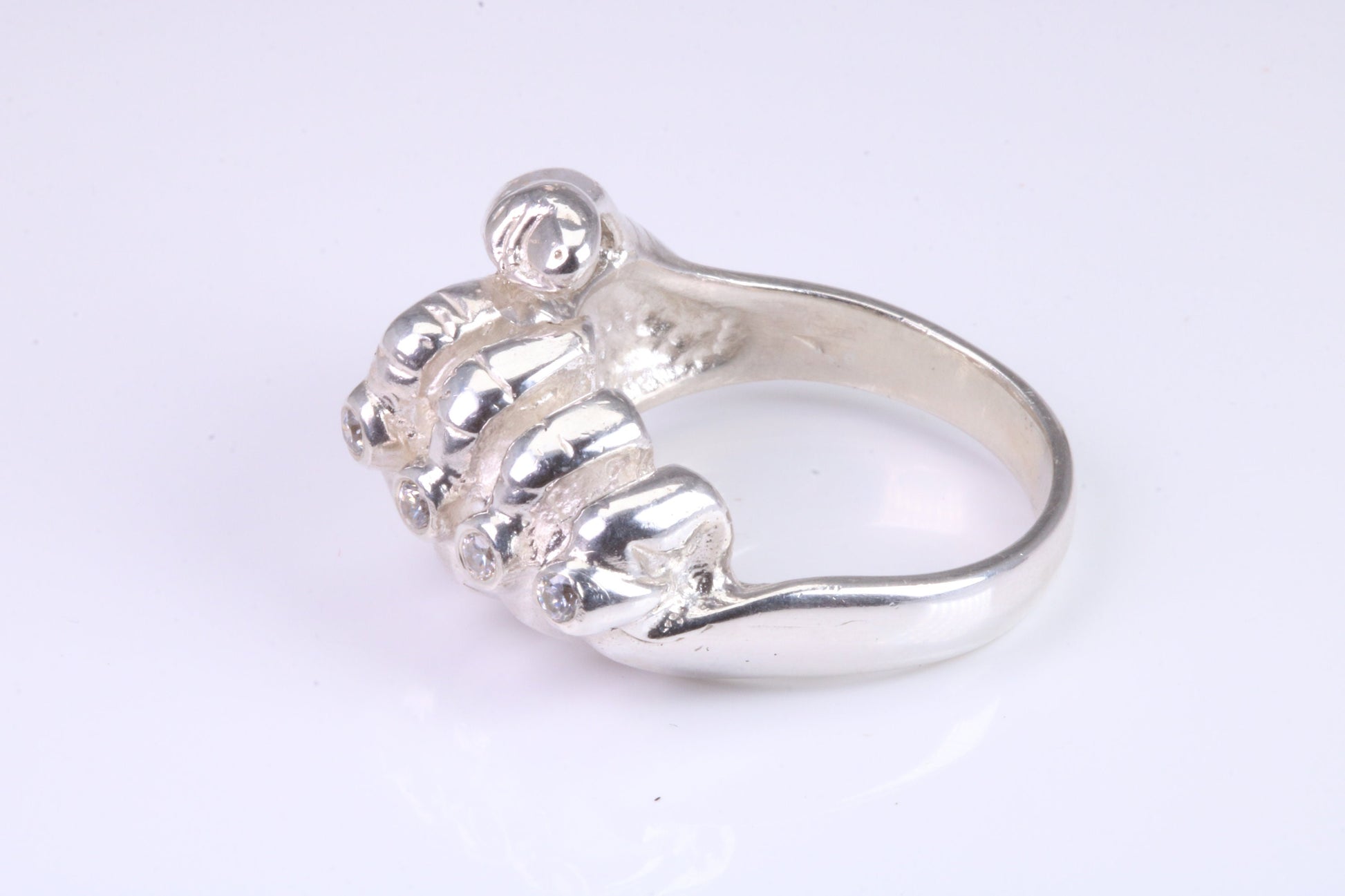 Very large and very heavy fist ring set with diamond white top grade cubic zirconia's, made from solid cast Silver , British Hallmarked