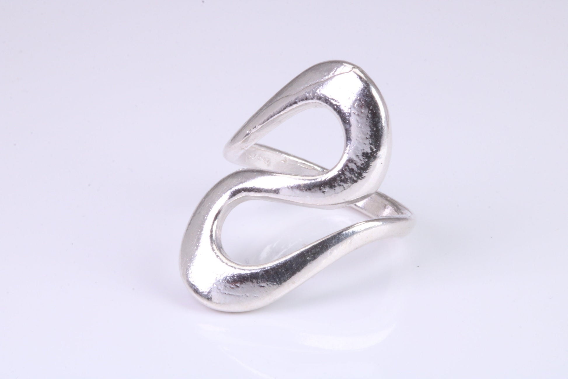 Large Abstract ring, made from solid cast silver, very smooth and fluid lines with high polished finish