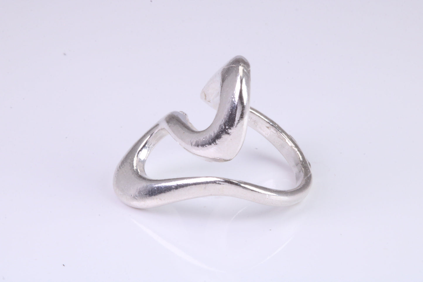 Large Abstract ring, made from solid cast silver, very smooth and fluid lines with high polished finish