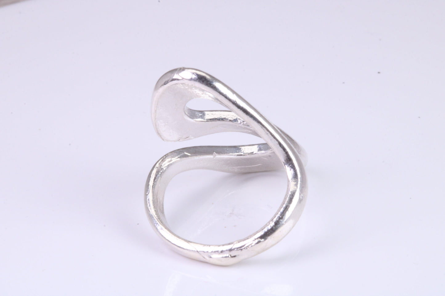 Large Abstract ring, made from solid cast silver, very smooth and fluid lines with high polished finish