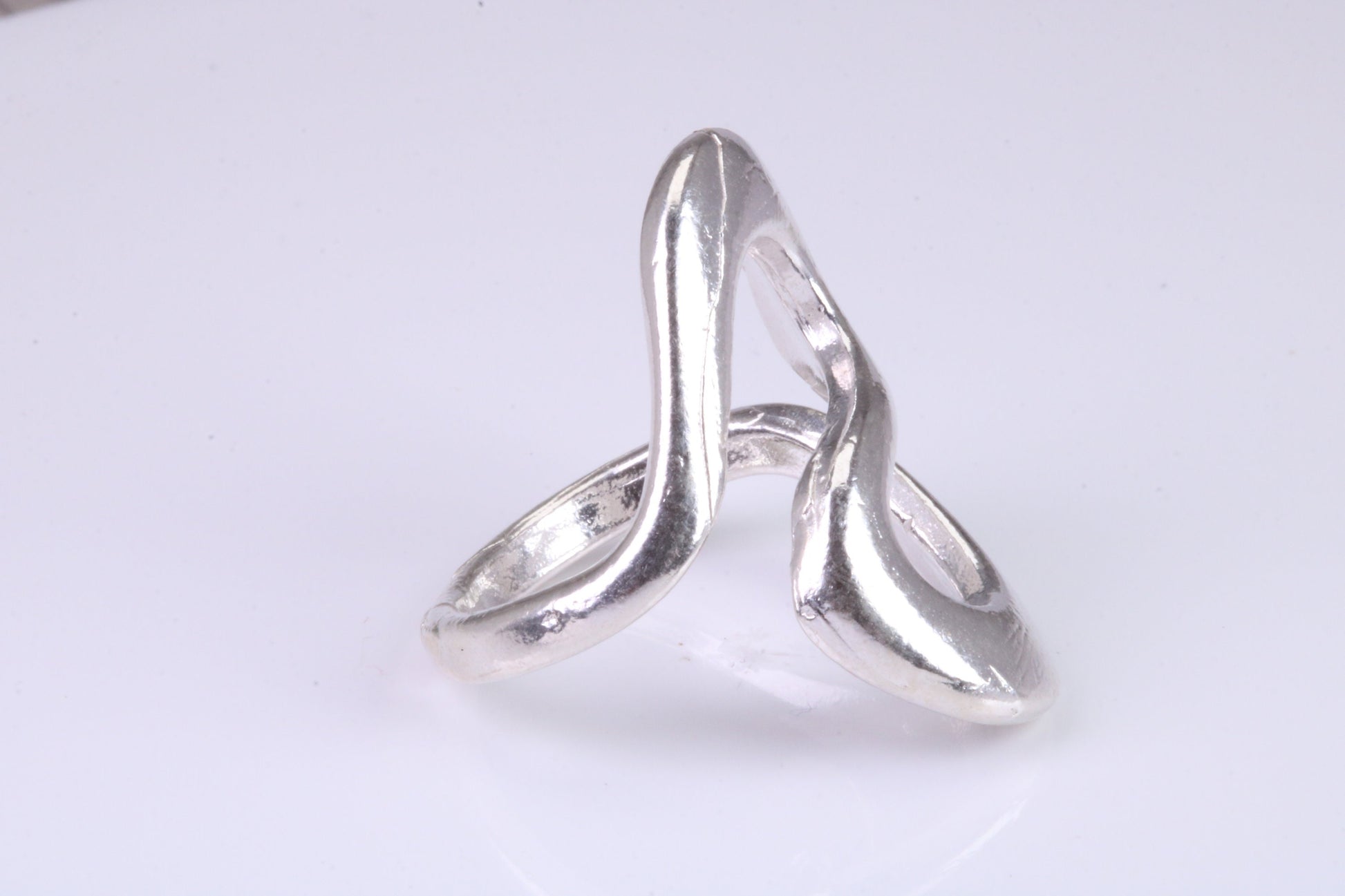 Large Abstract ring, made from solid cast silver, very smooth and fluid lines with high polished finish