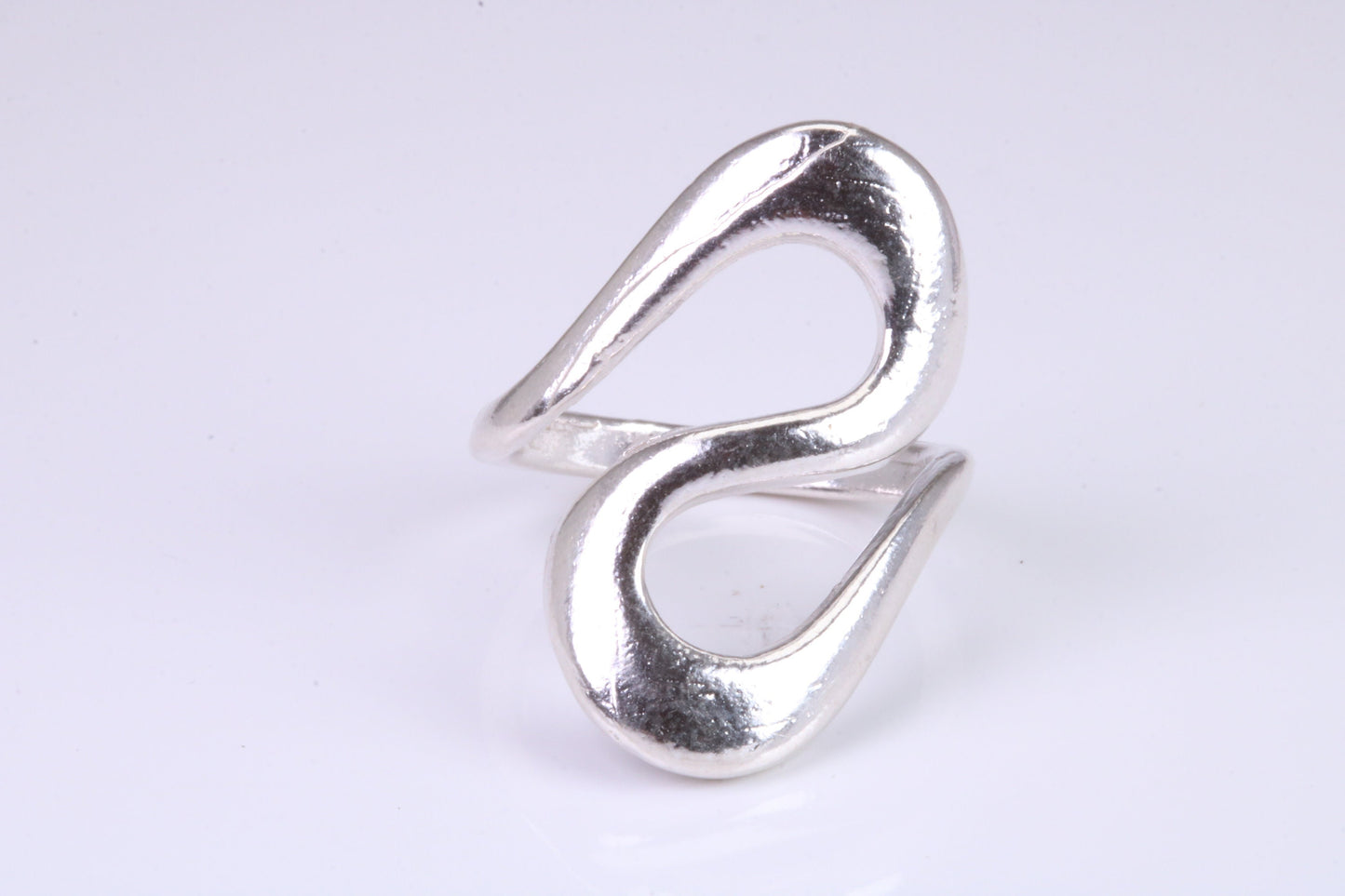 Large Abstract ring, made from solid cast silver, very smooth and fluid lines with high polished finish