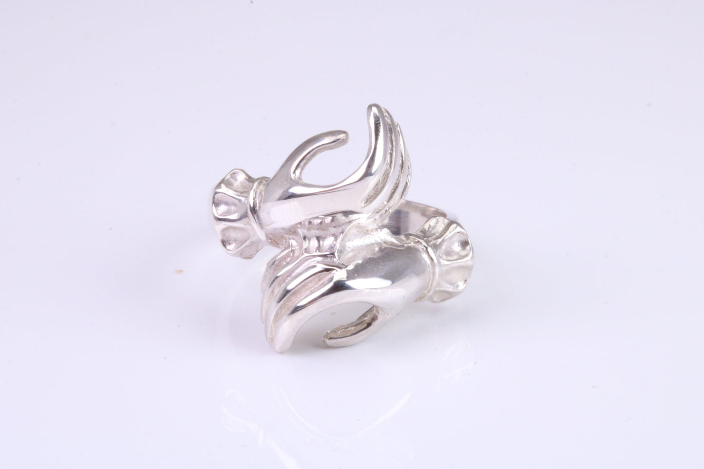 Two hands Ring, made from solid cast silver with high polished finish