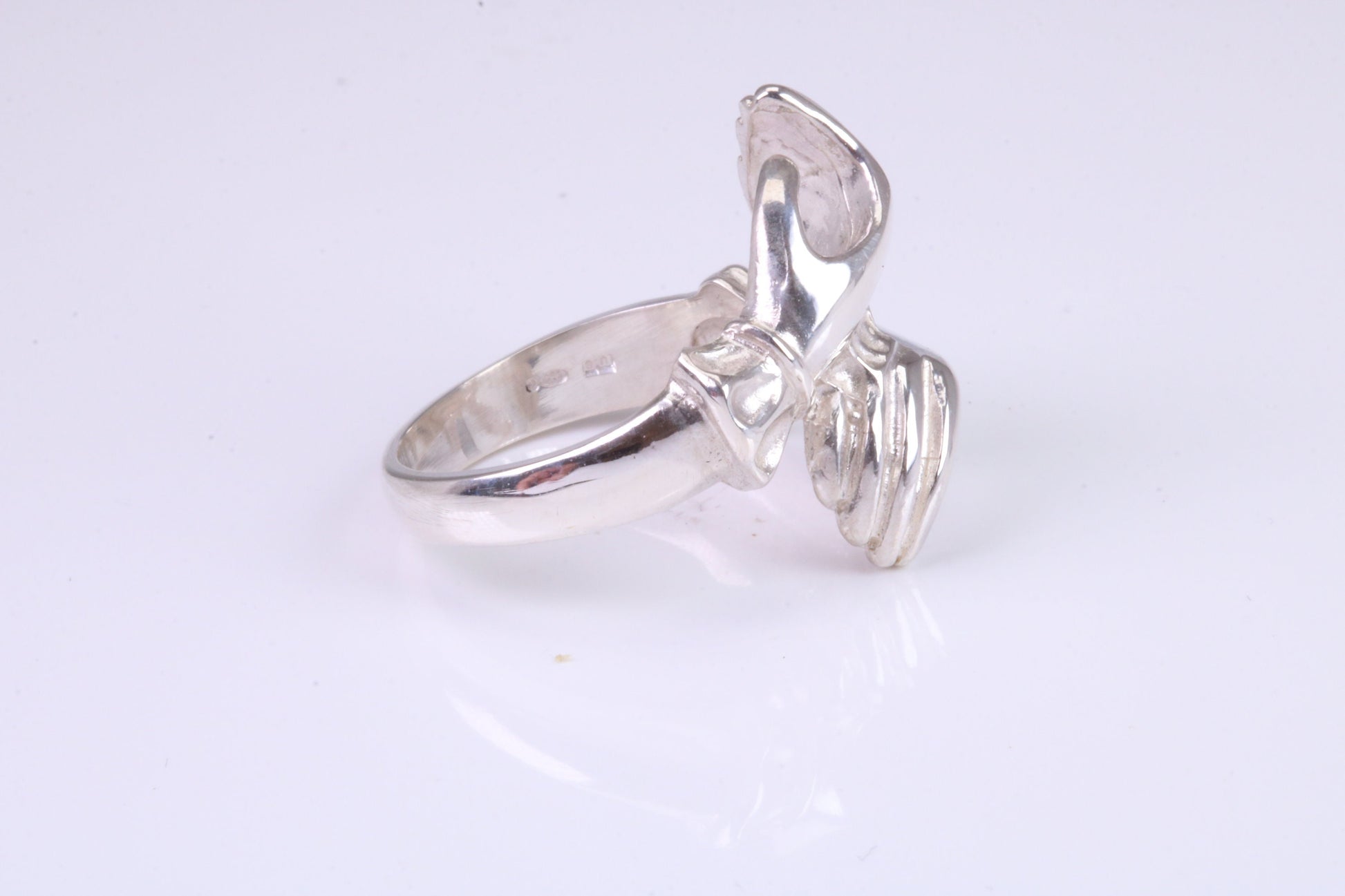 Two hands Ring, made from solid cast silver with high polished finish