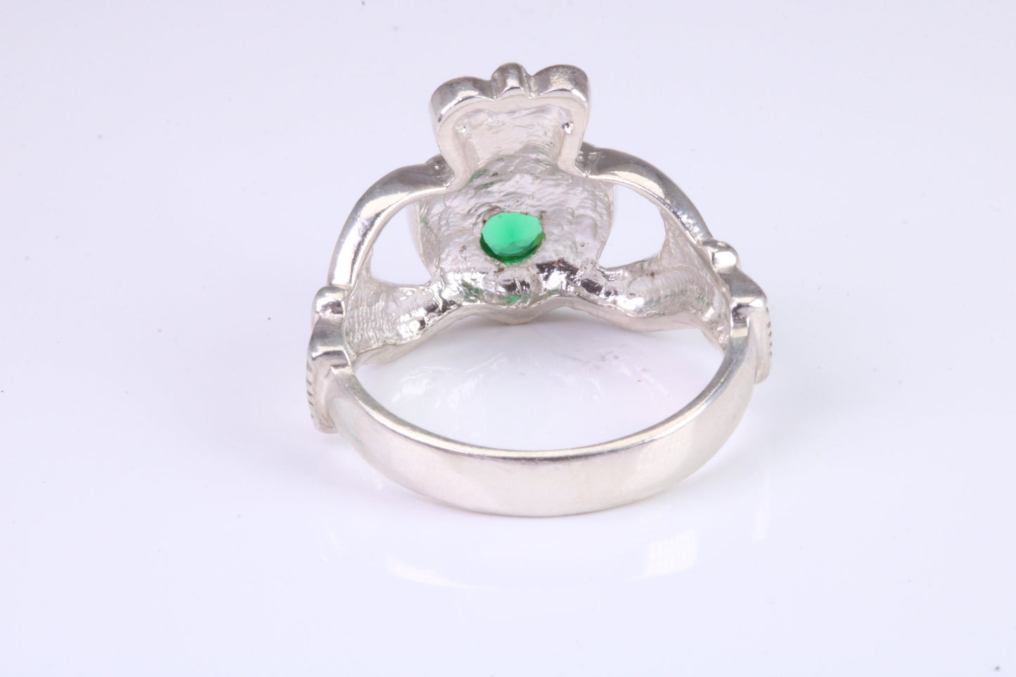 Large and heavy stone set Claddagh ring, set with Emerald Green C Z, solid cast silver