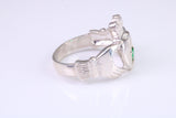 Large and heavy stone set Claddagh ring, set with Emerald Green C Z, solid cast silver