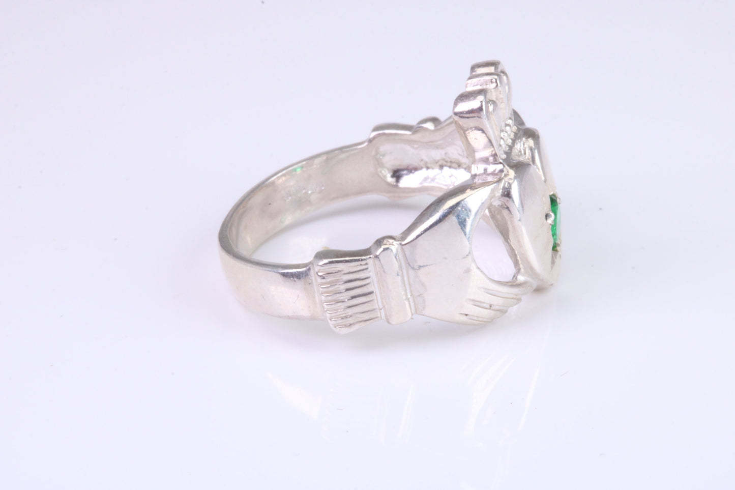 Large and heavy stone set Claddagh ring, set with Emerald Green C Z, solid cast silver