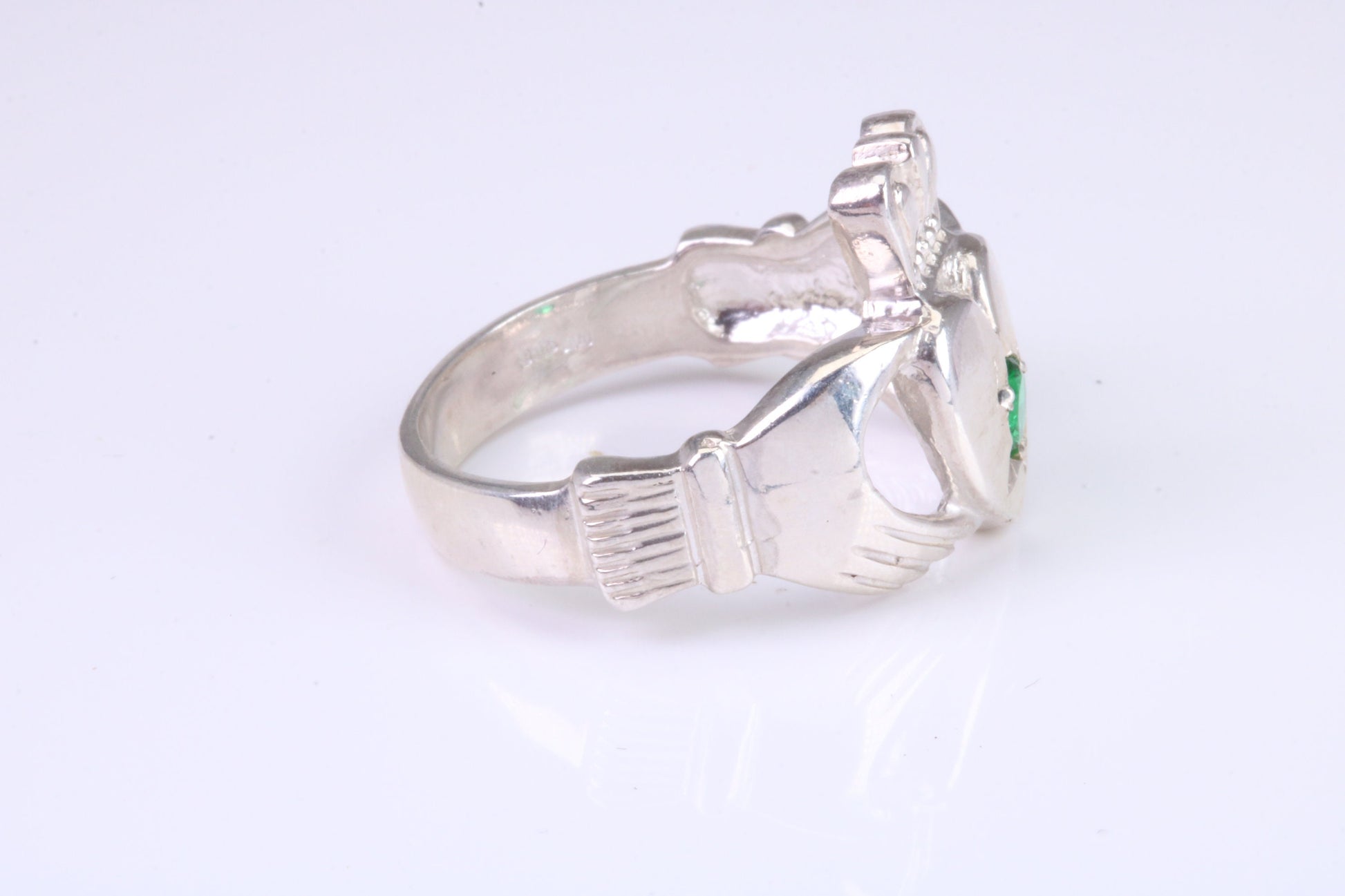 Large and heavy stone set Claddagh ring, set with Emerald Green C Z, solid cast silver
