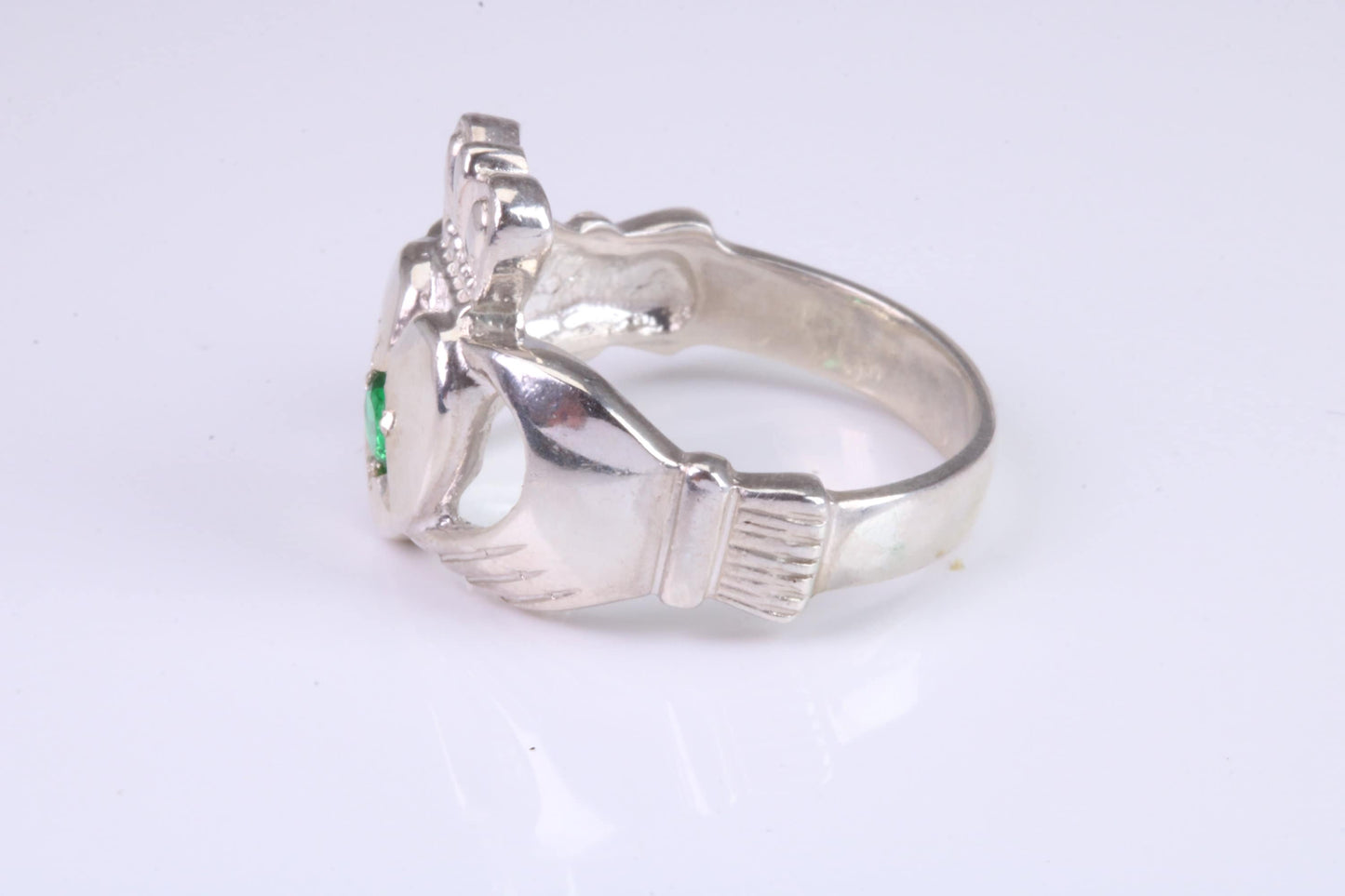 Large and heavy stone set Claddagh ring, set with Emerald Green C Z, solid cast silver