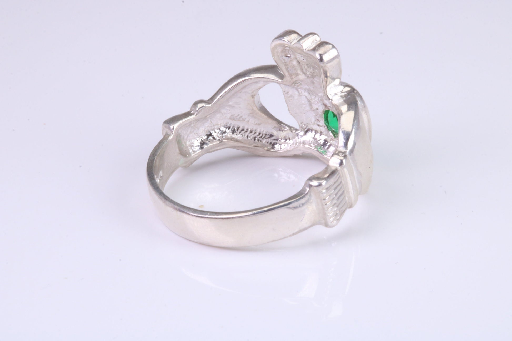 Large and heavy stone set Claddagh ring, set with Emerald Green C Z, solid cast silver
