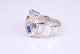 Large and heavy stone set Claddagh ring, set with Sapphire Blue C Z, solid cast silver