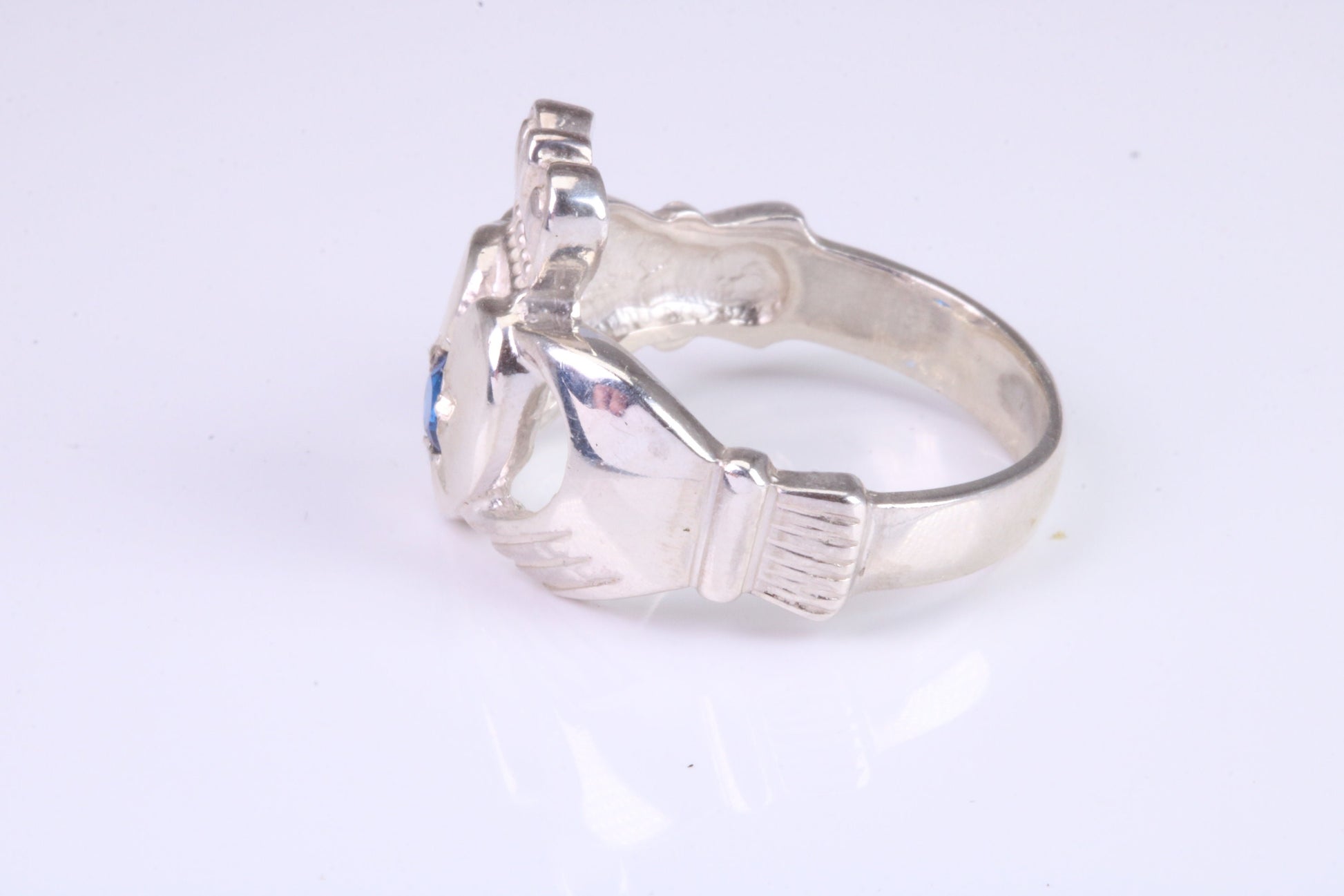 Large and heavy stone set Claddagh ring, set with Sapphire Blue C Z, solid cast silver