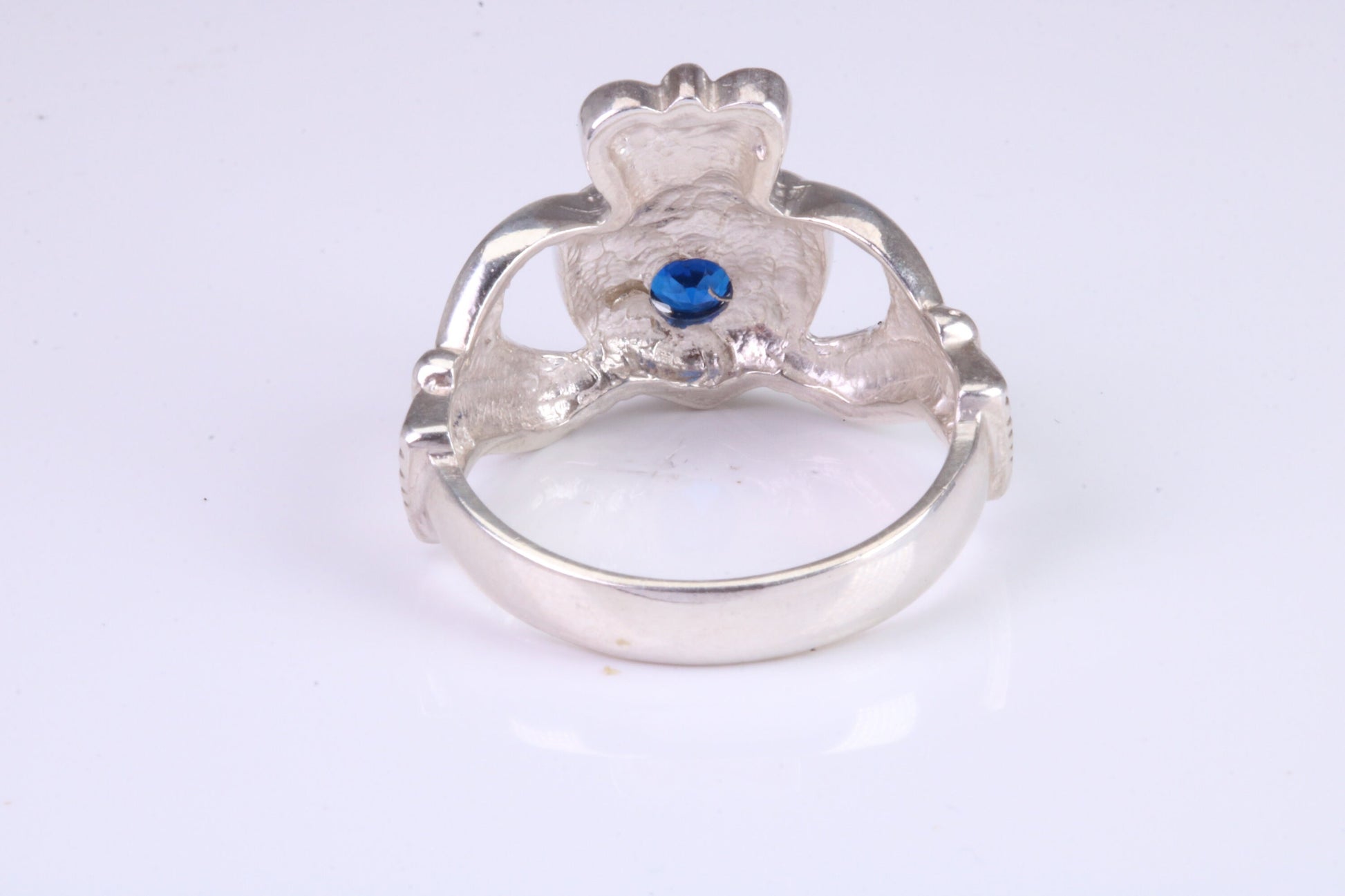 Large and heavy stone set Claddagh ring, set with Sapphire Blue C Z, solid cast silver
