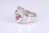 Large and heavy stone set Claddagh ring, set with Ruby Red C Z, solid cast silver