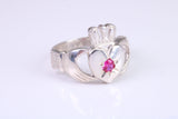 Large and heavy stone set Claddagh ring, set with Ruby Red C Z, solid cast silver