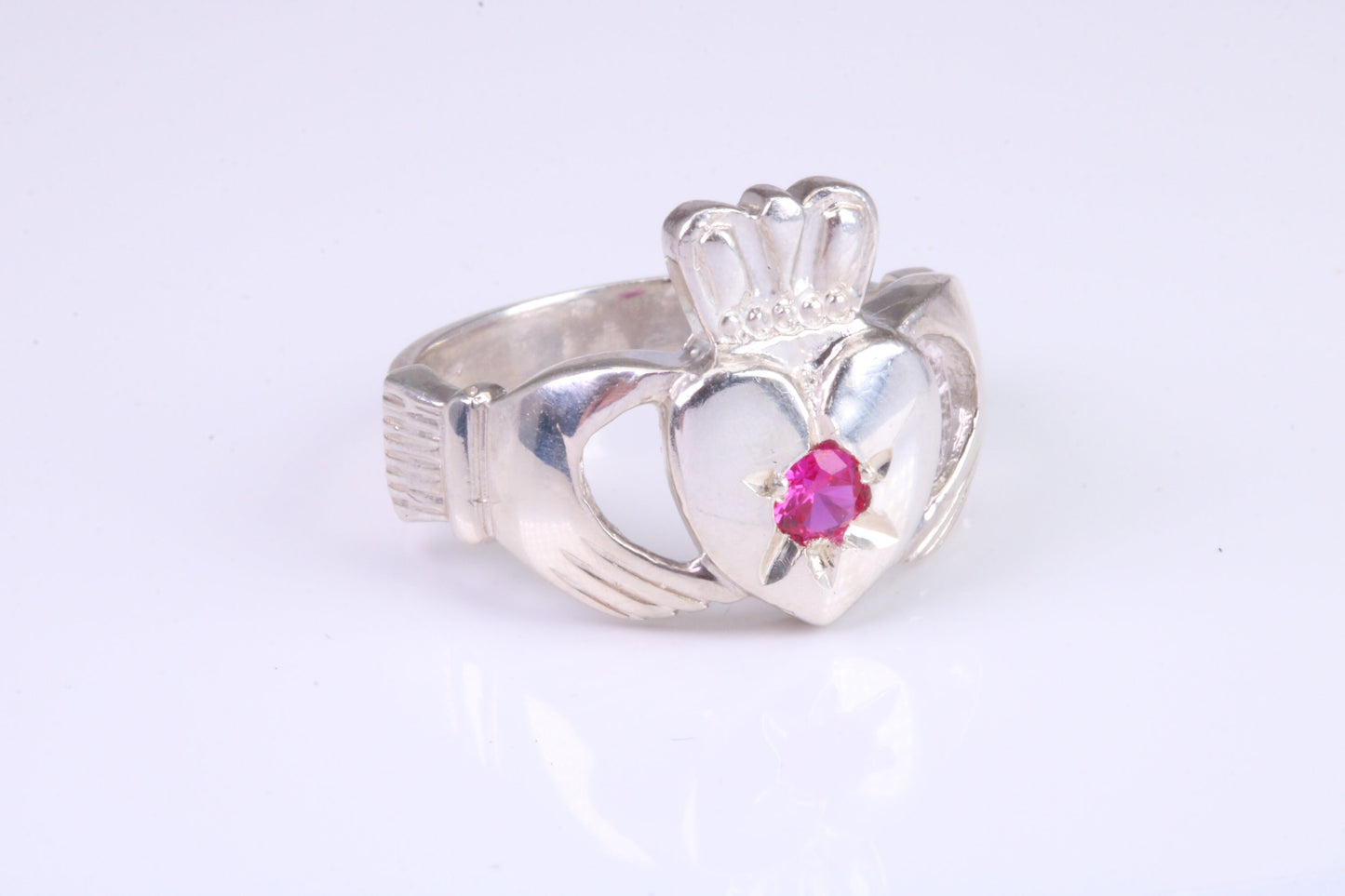 Large and heavy stone set Claddagh ring, set with Ruby Red C Z, solid cast silver