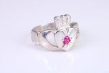 Large and heavy stone set Claddagh ring, set with Ruby Red C Z, solid cast silver