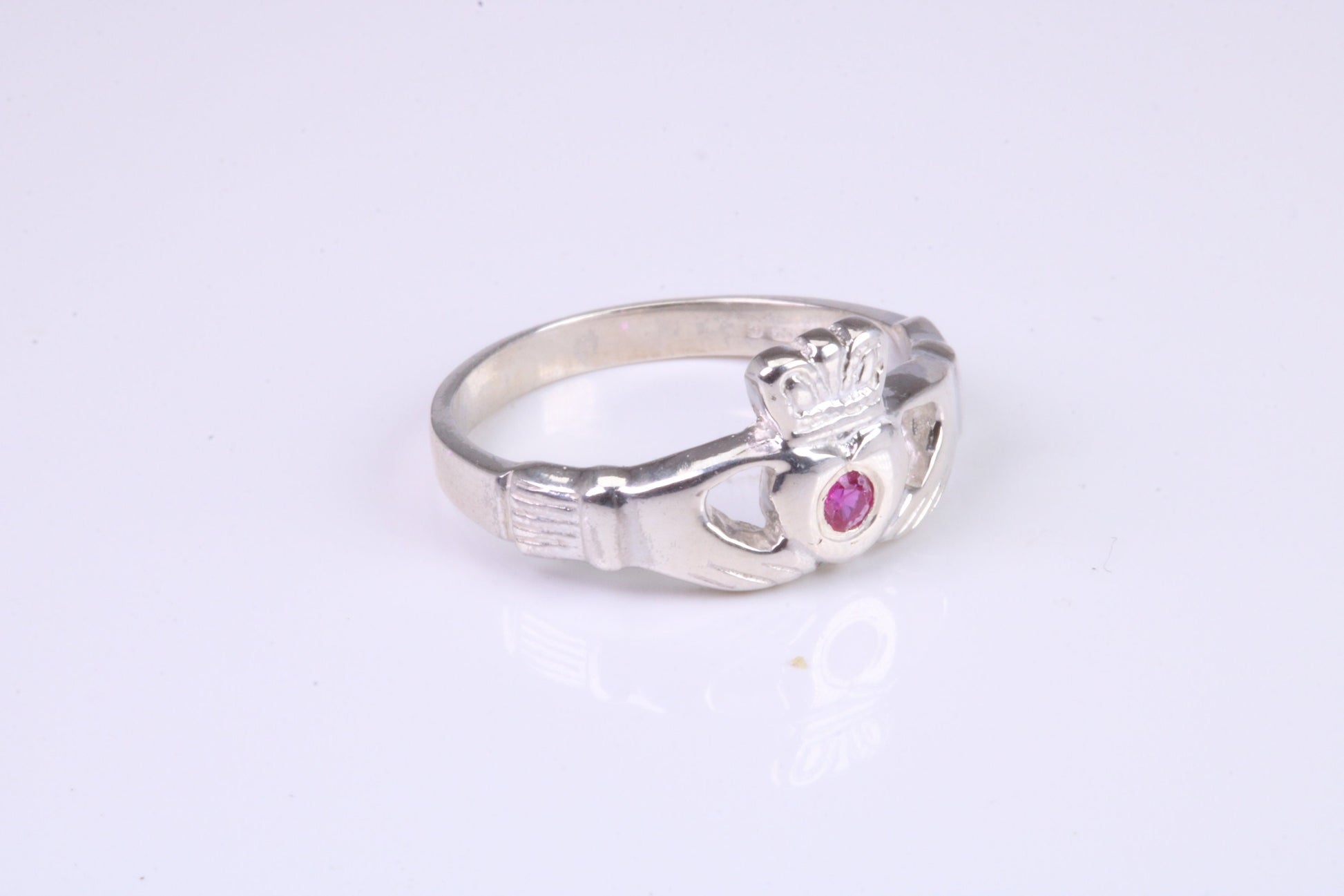 Dainty Ruby Red C Z set Claddagh ring, set with Ruby Red C Z, solid cast silver