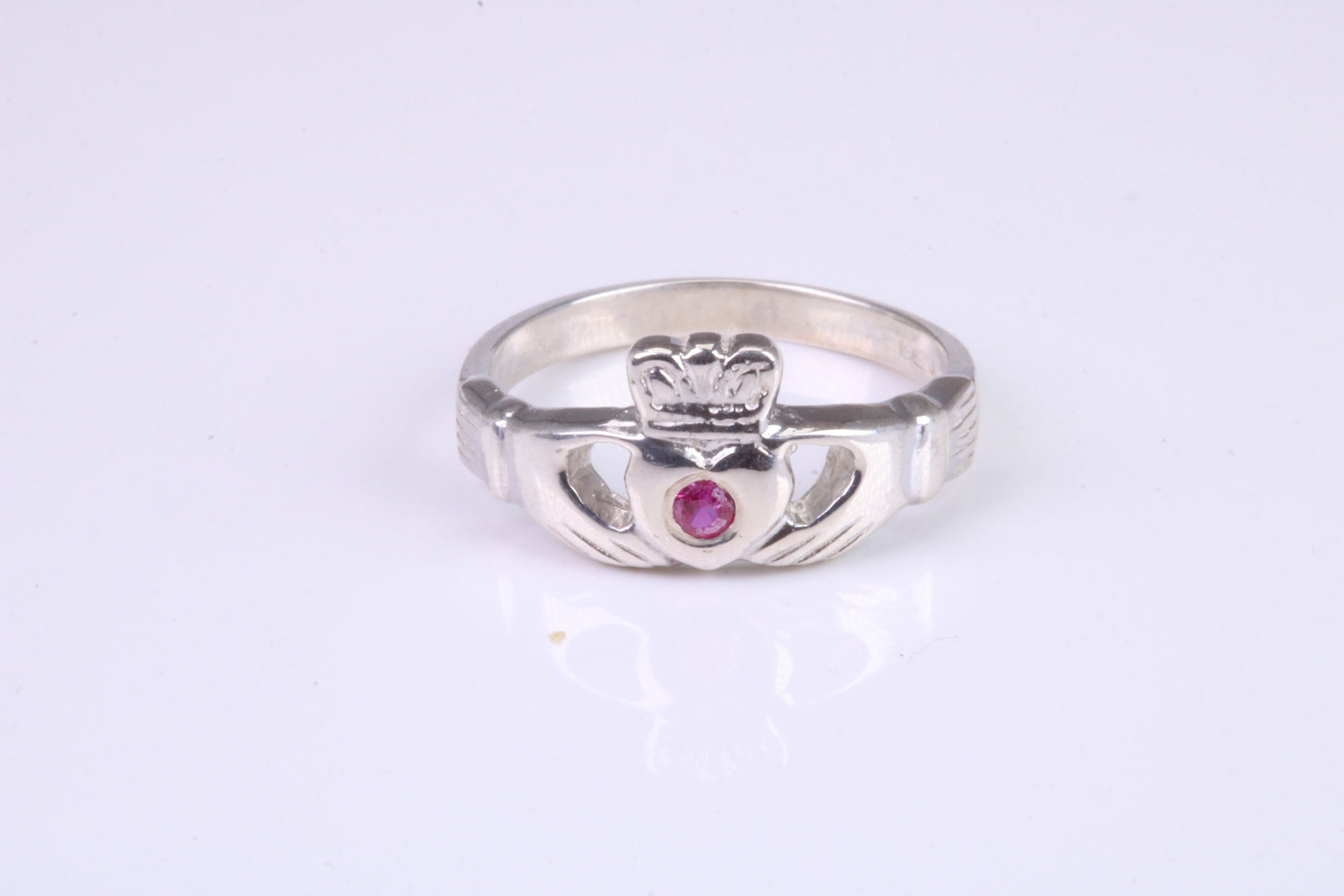 Dainty Ruby Red C Z set Claddagh ring, set with Ruby Red C Z, solid cast silver