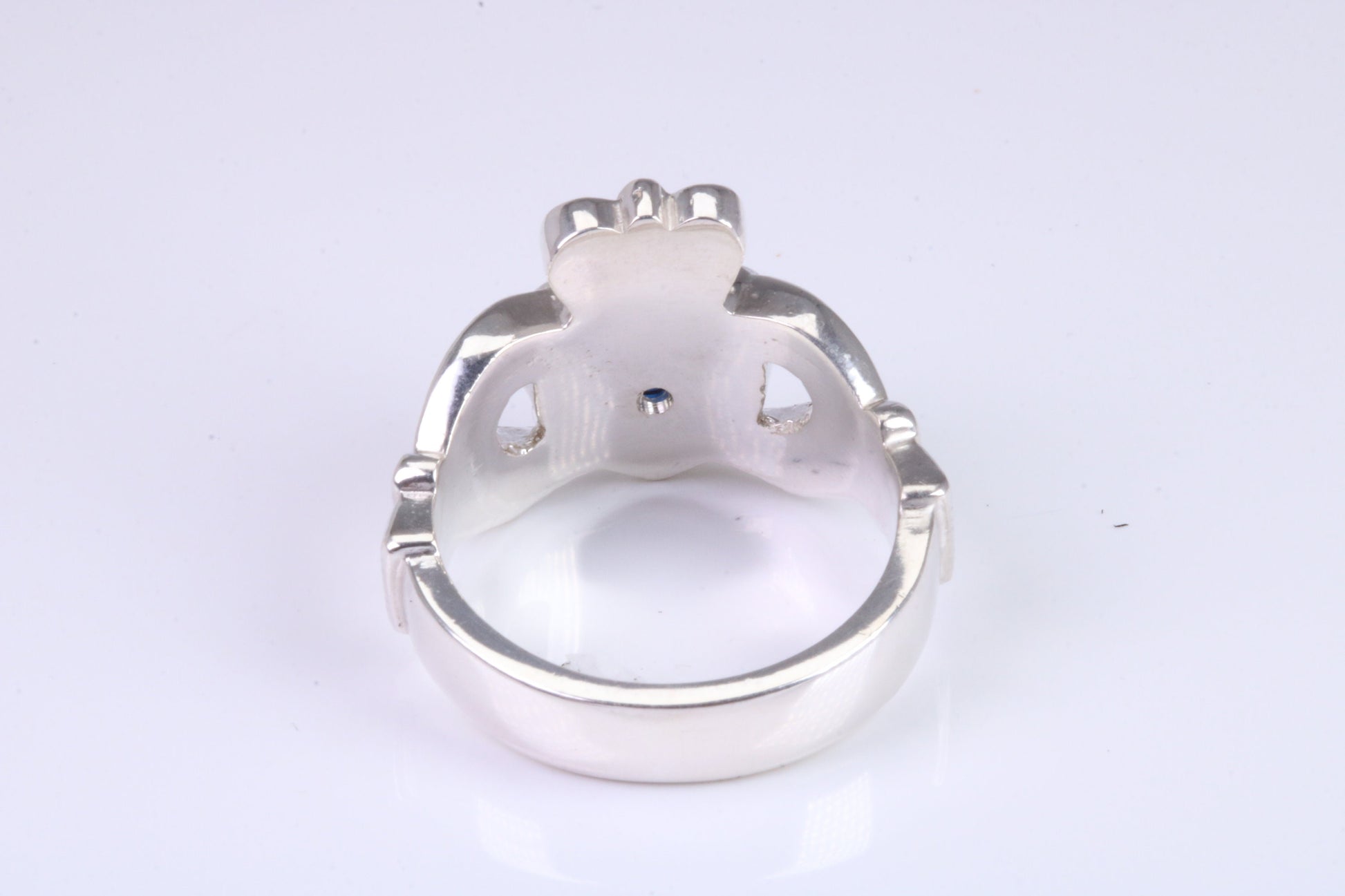 Large and heavy Sapphire Blue C Z set Claddagh ring, made from solid cast silver, British hallmarked