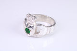 Large and heavy Emerald Green C Z set Claddagh ring, made from solid cast silver, British hallmarked