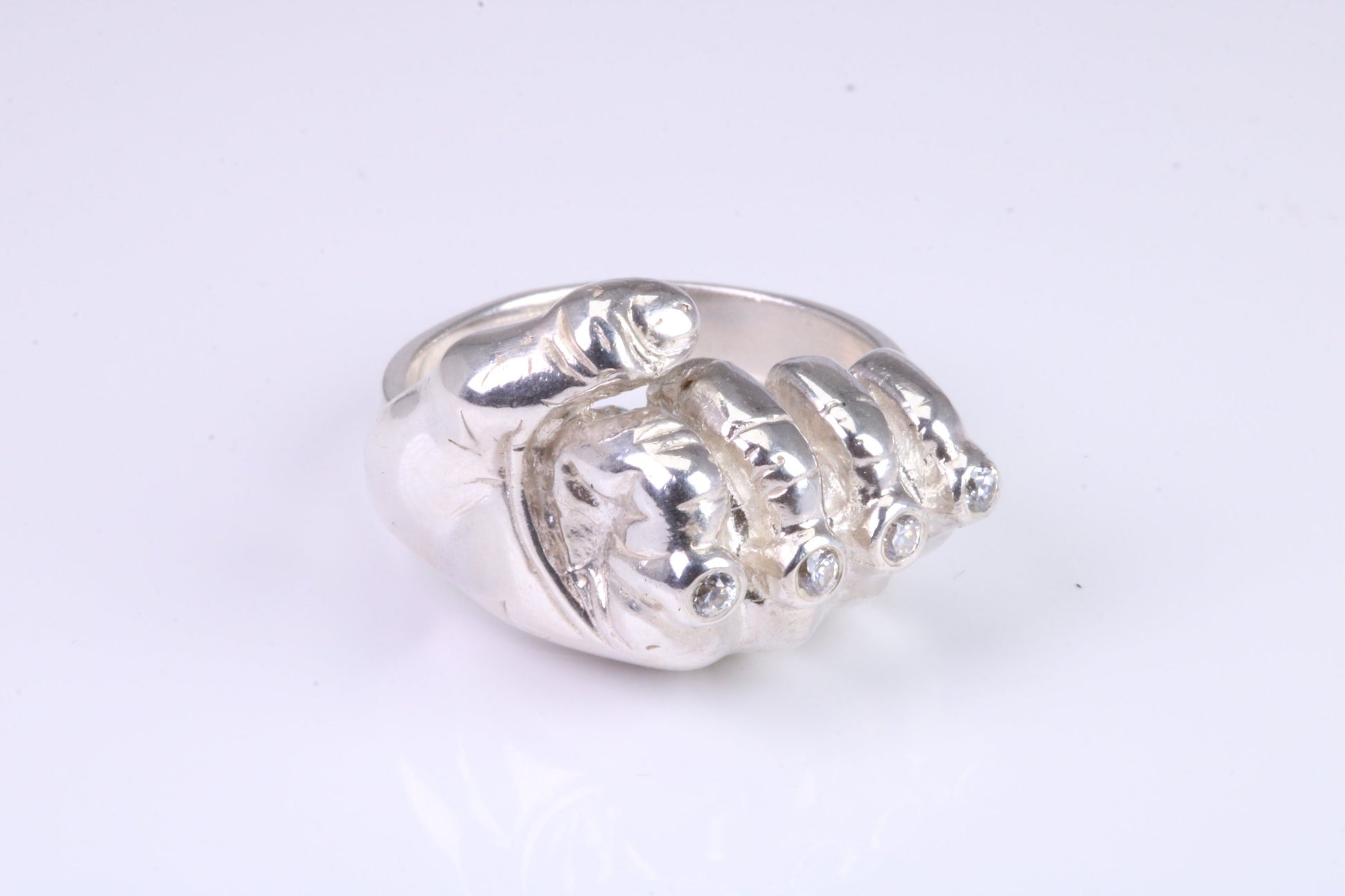 Very large and very heavy fist ring set with diamond white top grade cubic zirconia's, made from solid cast Silver , British Hallmarked