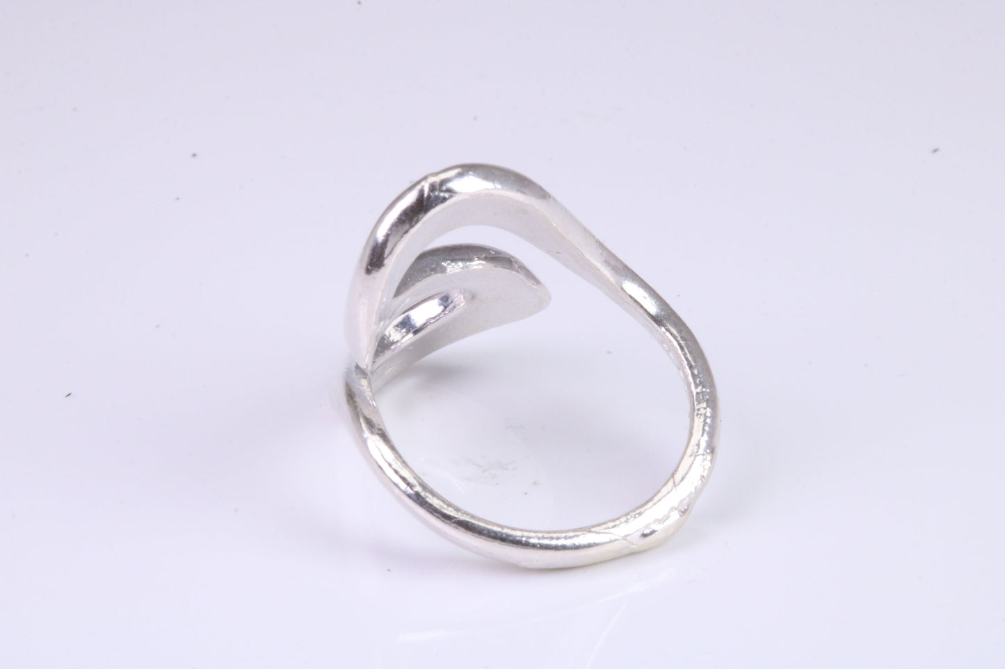 Large Abstract ring, made from solid cast silver, very smooth and fluid lines with high polished finish