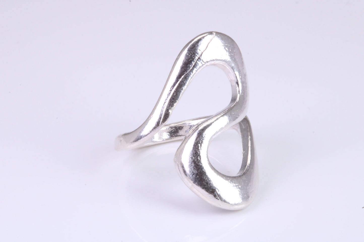 Large Abstract ring, made from solid cast silver, very smooth and fluid lines with high polished finish