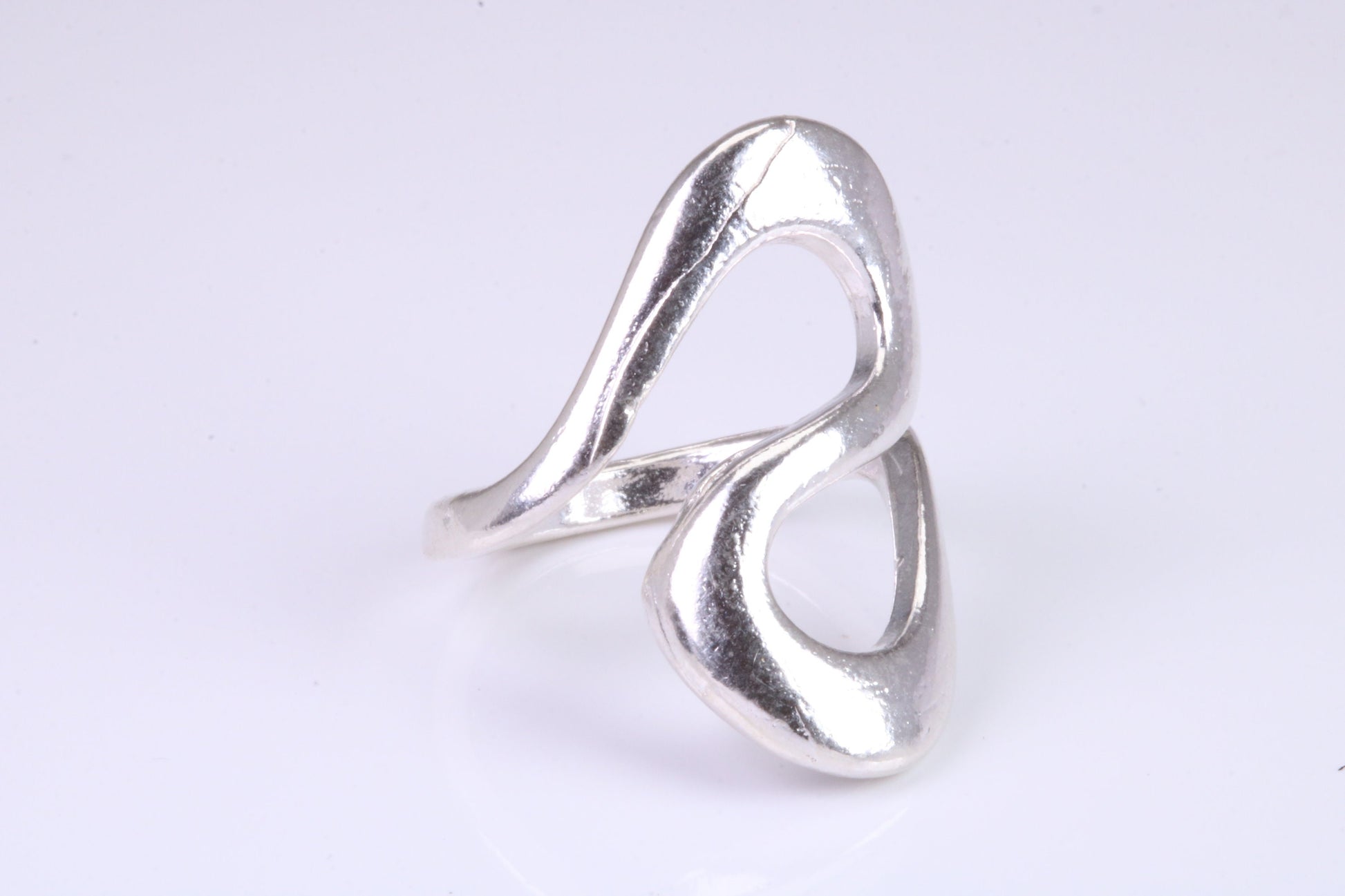 Large Abstract ring, made from solid cast silver, very smooth and fluid lines with high polished finish