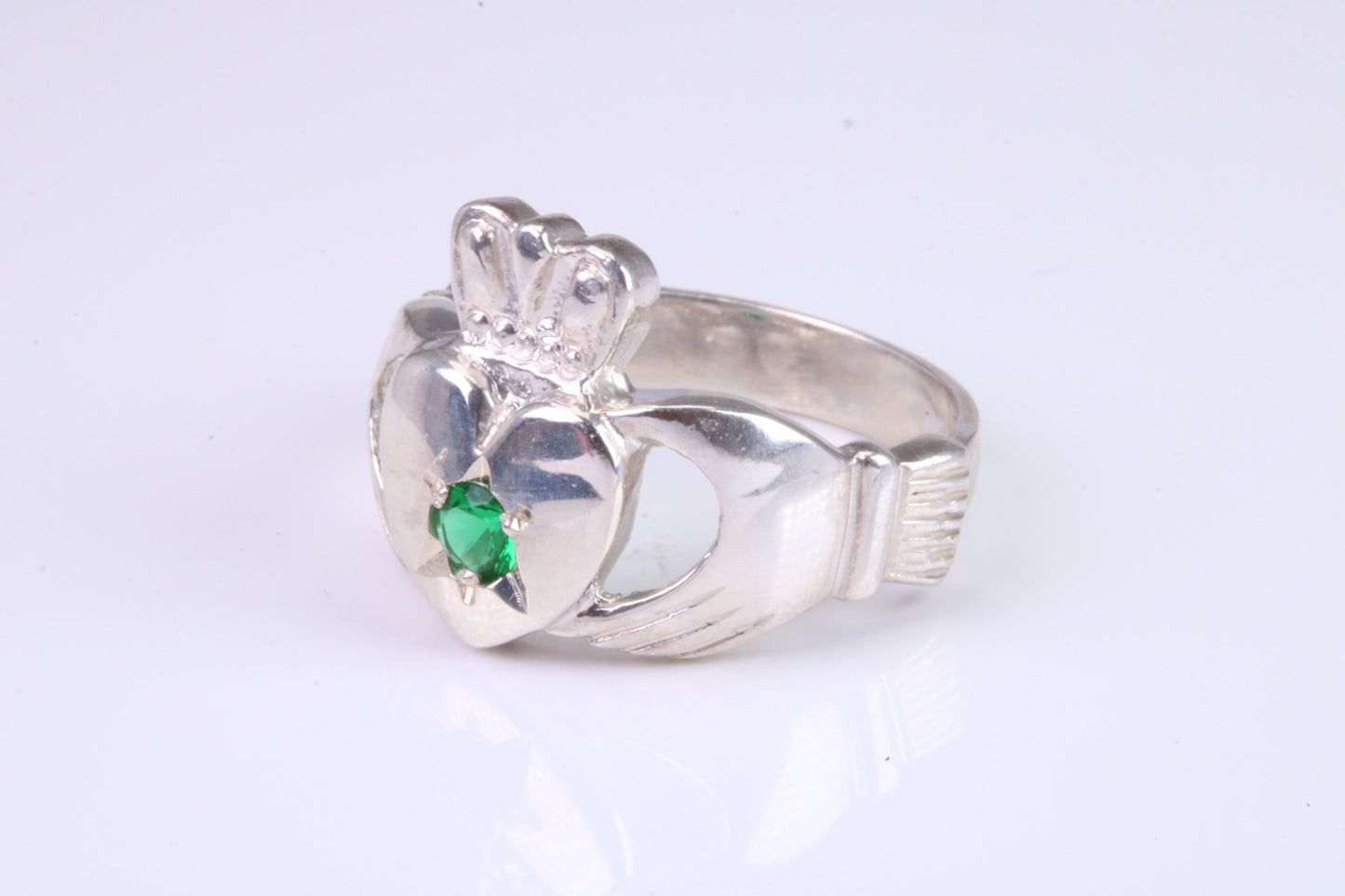 Large and heavy stone set Claddagh ring, set with Emerald Green C Z, solid cast silver