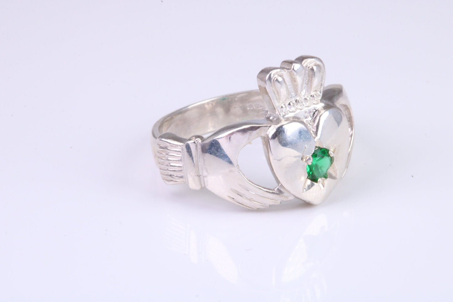 Large and heavy stone set Claddagh ring, set with Emerald Green C Z, solid cast silver