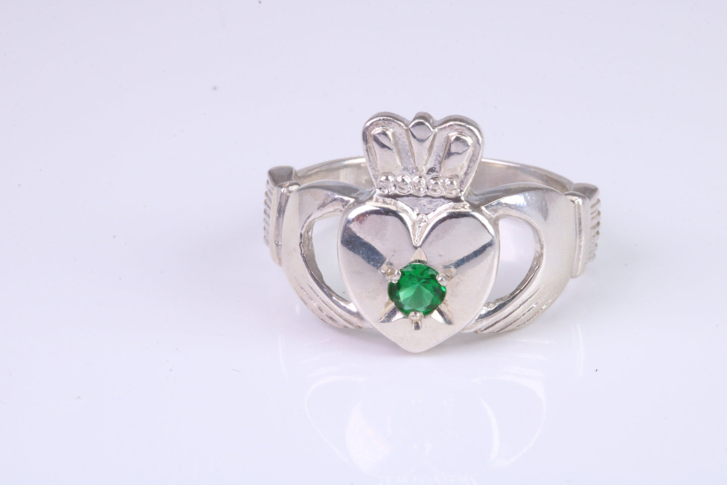 Large and heavy stone set Claddagh ring, set with Emerald Green C Z, solid cast silver