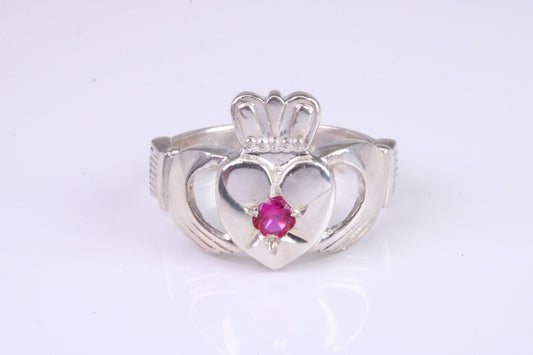 Large and heavy stone set Claddagh ring, set with Ruby Red C Z, solid cast silver