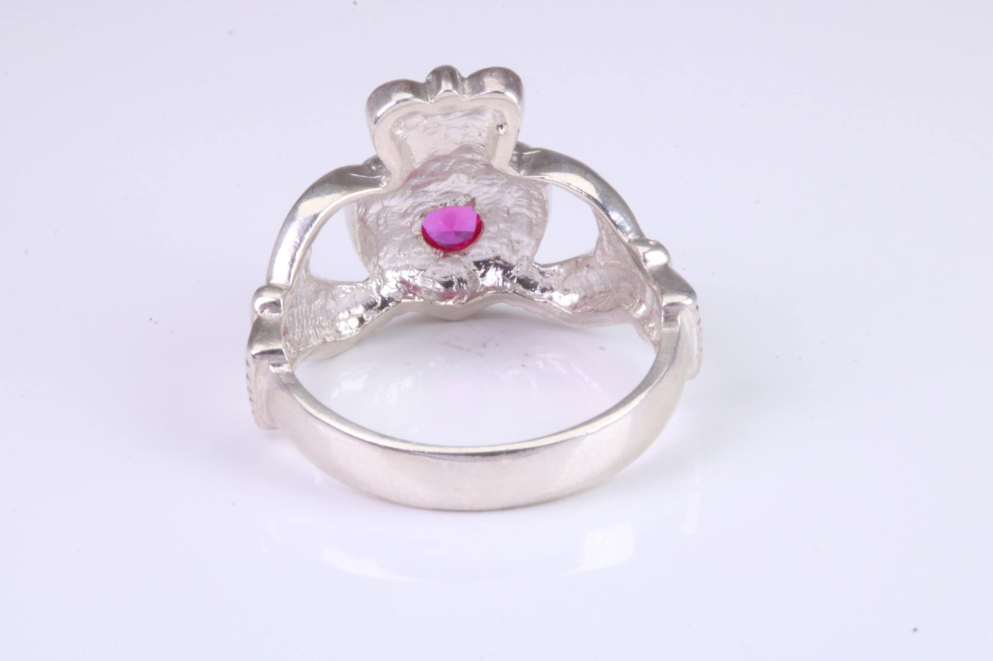 Large and heavy stone set Claddagh ring, set with Ruby Red C Z, solid cast silver