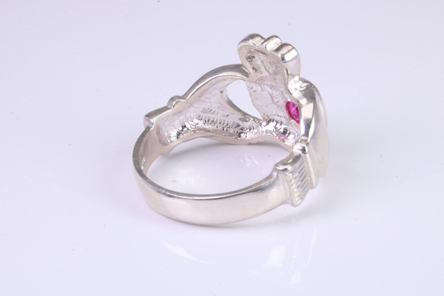 Large and heavy stone set Claddagh ring, set with Ruby Red C Z, solid cast silver