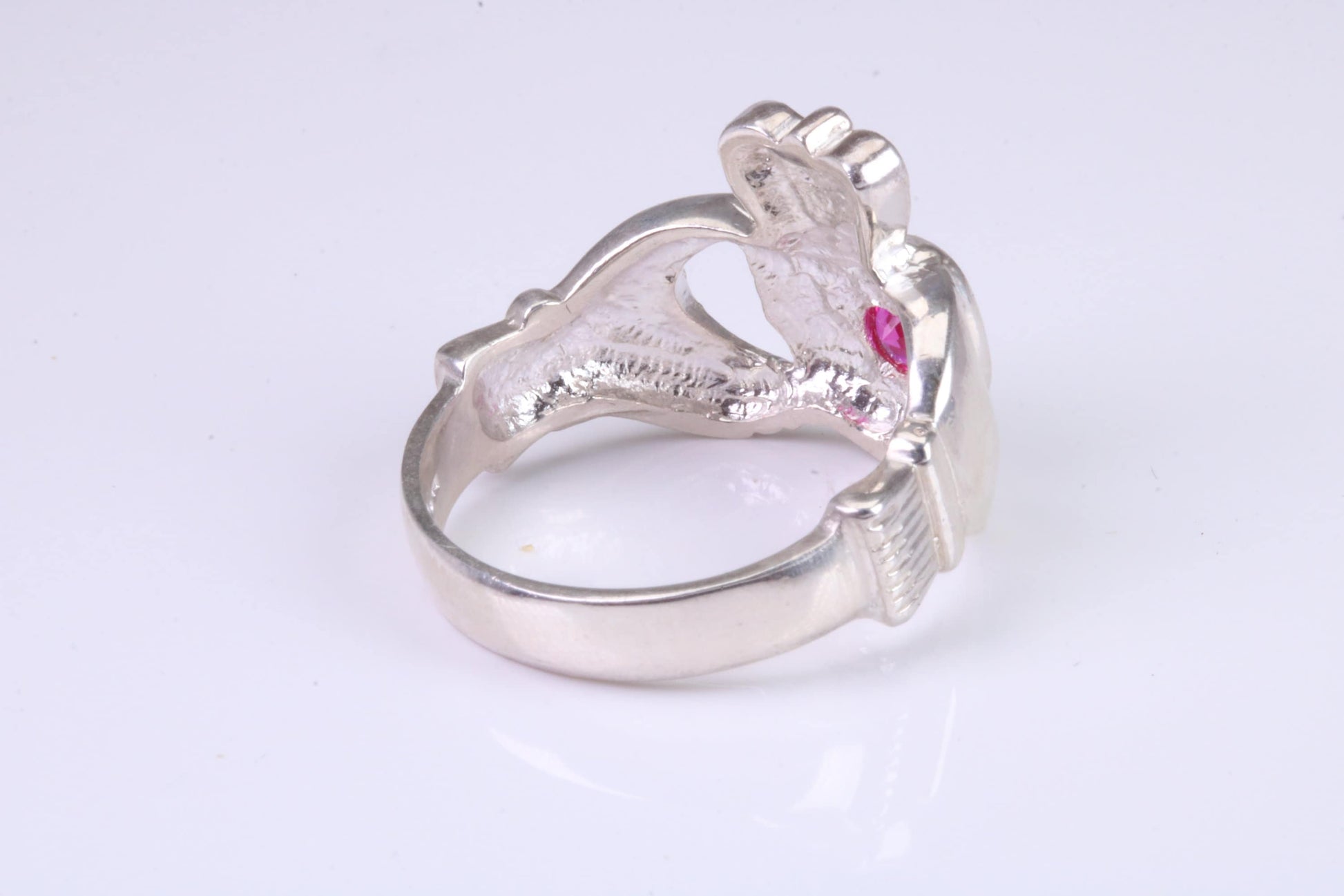 Large and heavy stone set Claddagh ring, set with Ruby Red C Z, solid cast silver