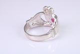 Large and heavy stone set Claddagh ring, set with Ruby Red C Z, solid cast silver