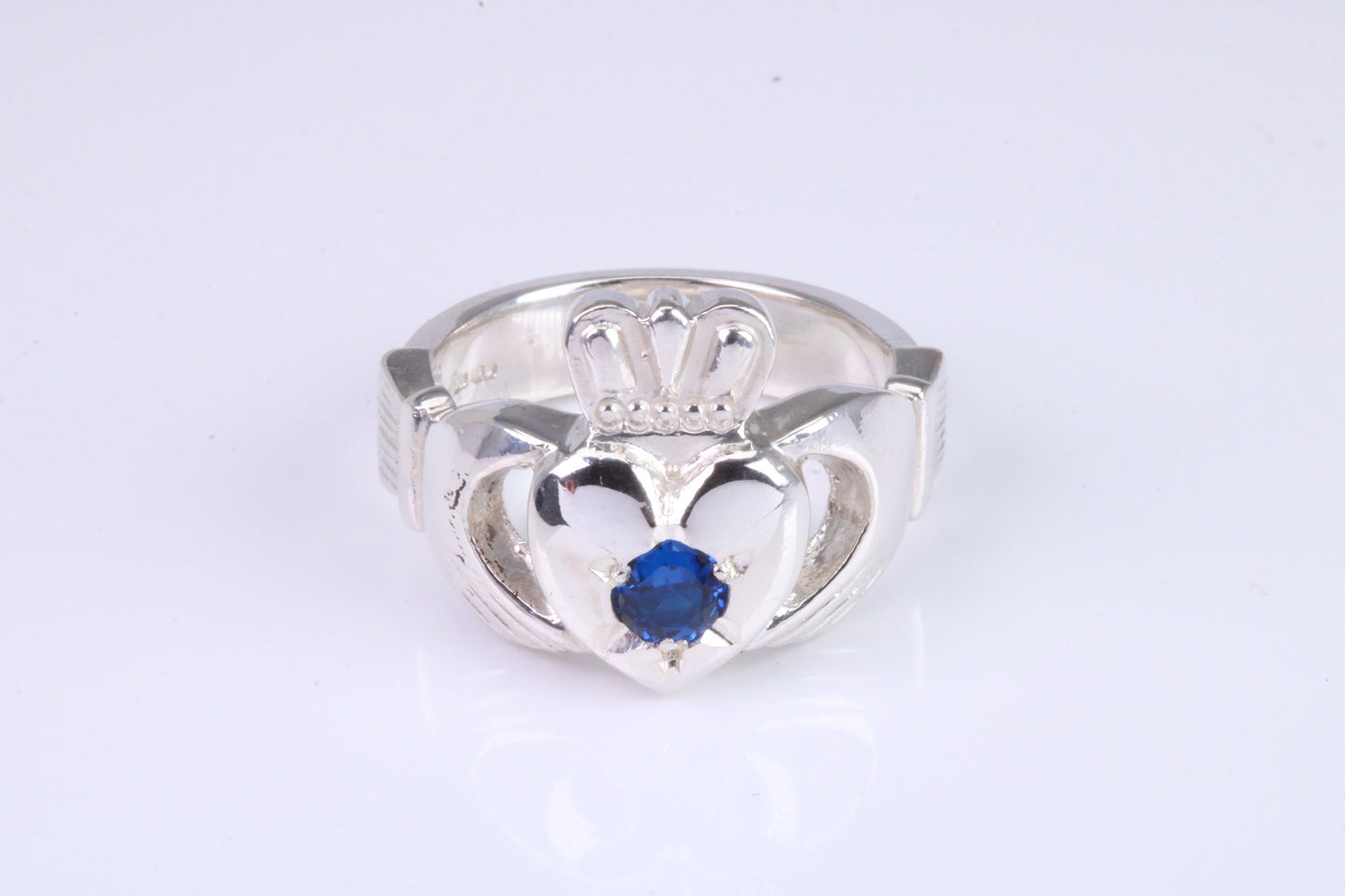 Large and heavy Sapphire Blue C Z set Claddagh ring, made from solid cast silver, British hallmarked