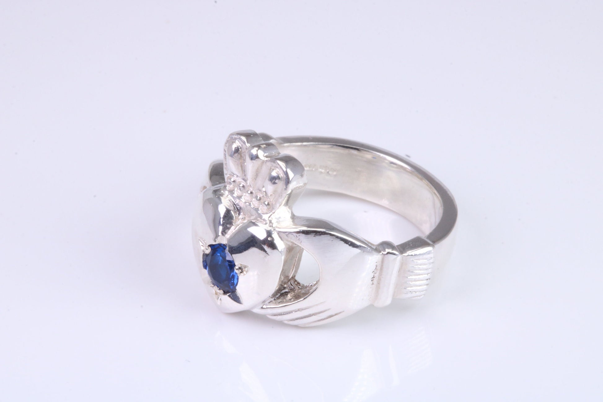 Large and heavy Sapphire Blue C Z set Claddagh ring, made from solid cast silver, British hallmarked